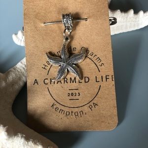 NWT, Handmade by A Charmed Life. Silver Bail & Starfish.